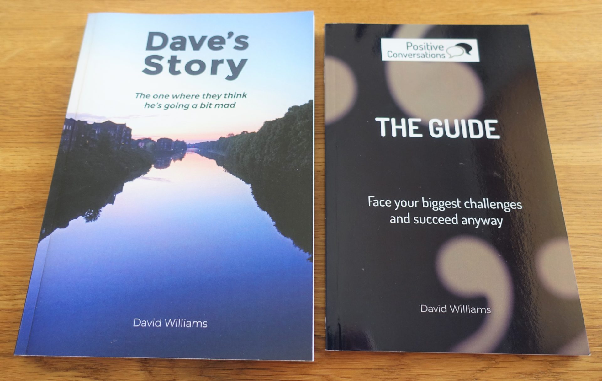 Two book covers on table